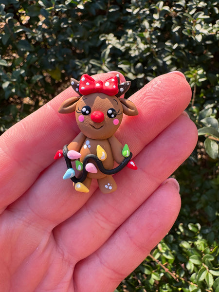 Reindeer with lights red bow